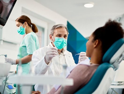 Dentist treats patient